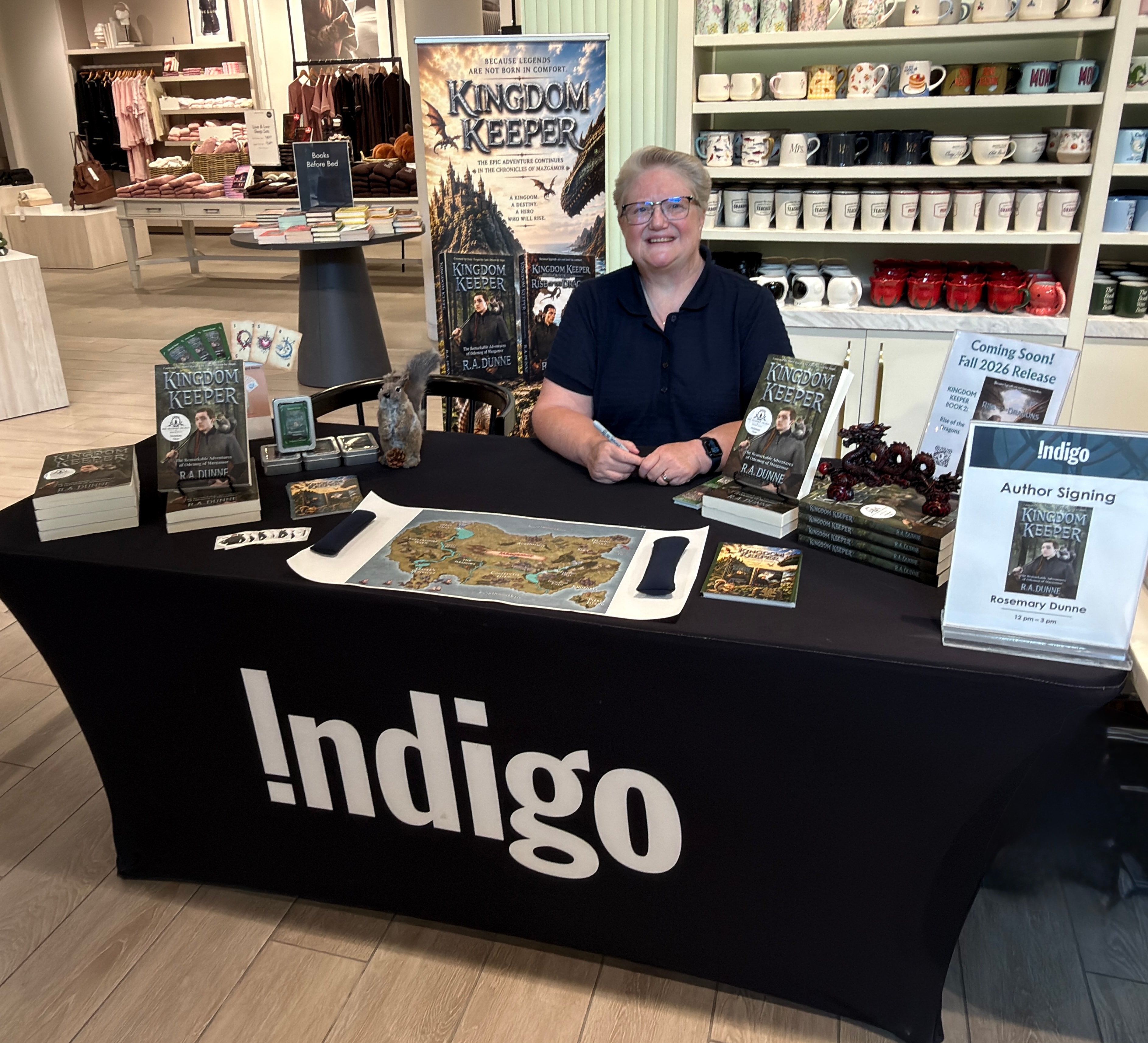 R.A. Dunne at the Indigo author signing event with Kingdom Keeper books on display