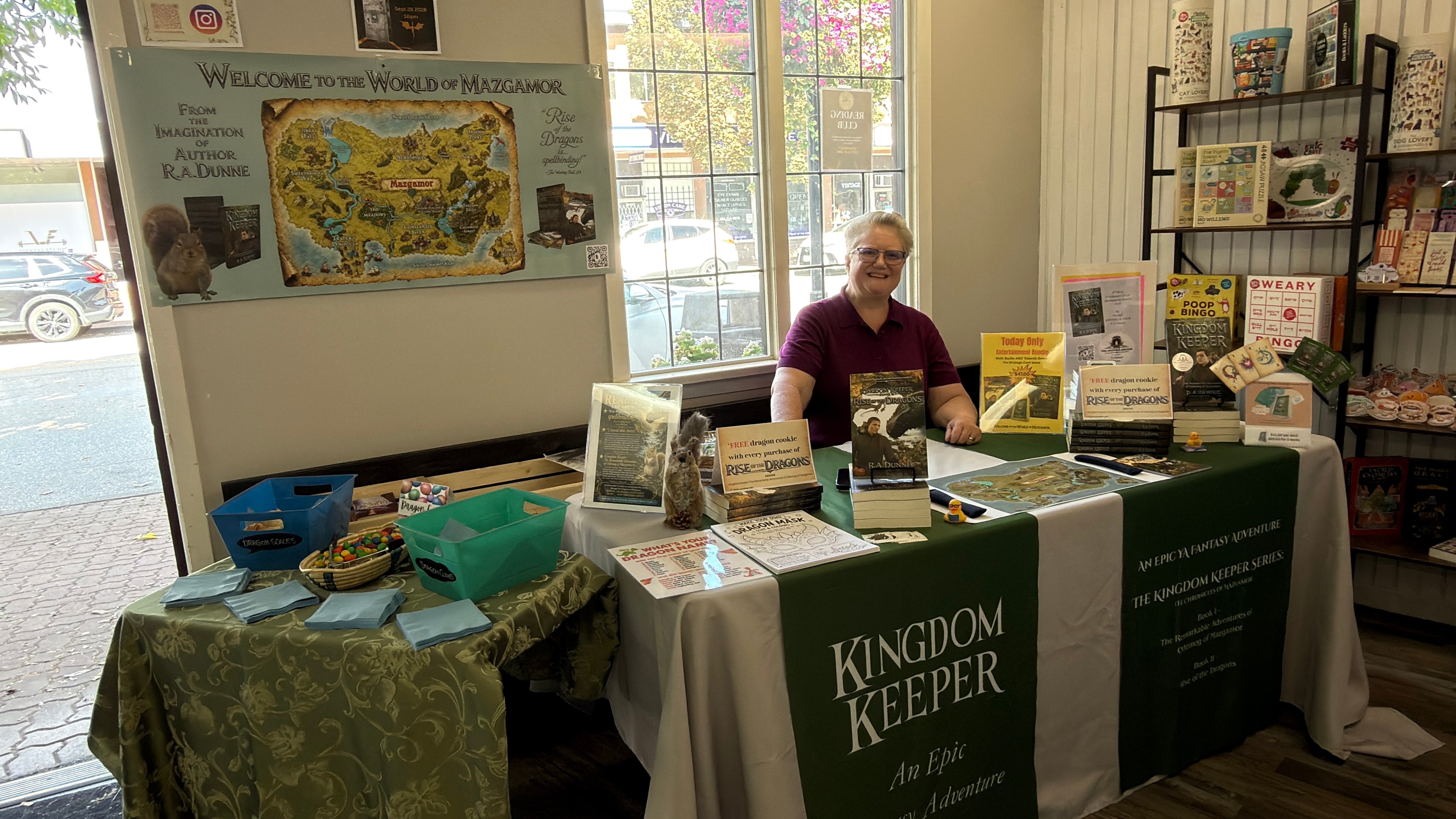 R.A. Dunne at a Kingdom Keeper book signing event with Welcome to the World of Mazgamor display